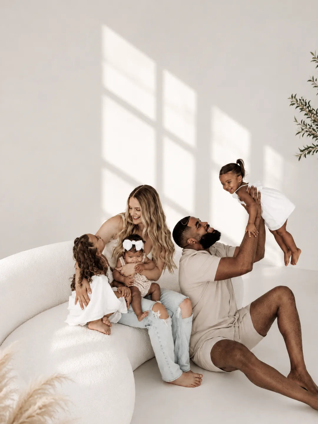 Family sitting together in a bright Lifeforce Living room